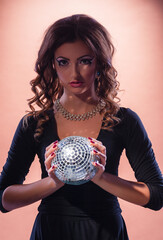 Young woman with a glowing ball..