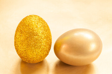 Easter real unique still life composition. Golden and glittery eggs..Creative retro minimal background..