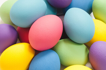 Fototapeta na wymiar Creative Easter composition of colorful eggs. Flat lay minimal background.