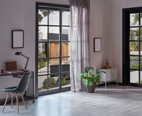 Modern rom with working table and armchair style, parquet floor, frame lamp decor, curtain, garden view house interior.