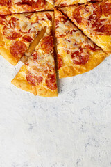 Tasty hot homemade pepperoni pizza. Traditional classic pizza with salami and cheese. Top view with copy space for text.