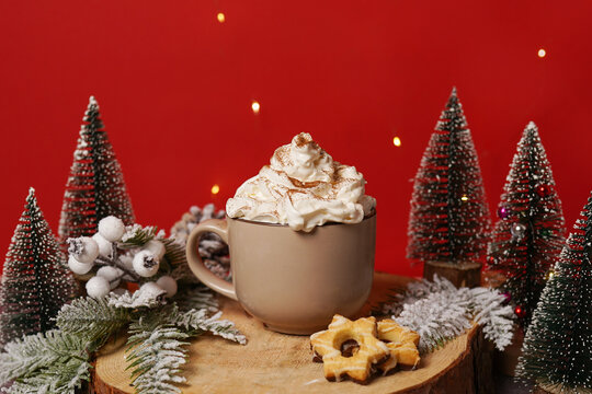 Hot Coffee cup on winter red background with cookies, Christmas holiday