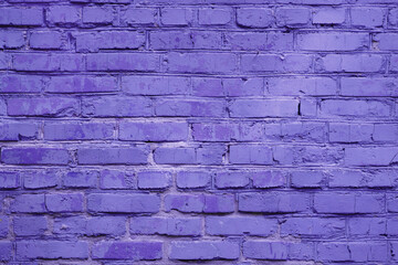 Fototapeta premium Fragment of street brick wall toned in trendy color of the 2022 year