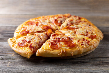 Tasty hot homemade pepperoni pizza. Traditional classic pizza with salami and cheese.