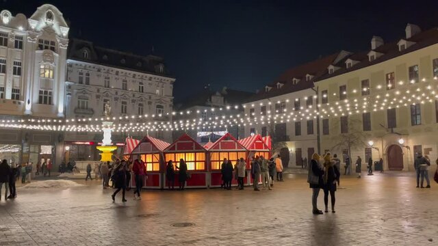 Bratislava main Christmas tree at night. Closed Christmas market during Christmas time causes by Covid-19. Traditional Christmas atmosphere. 