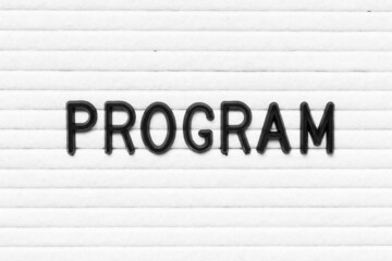 Black letter in word program on white felt board background