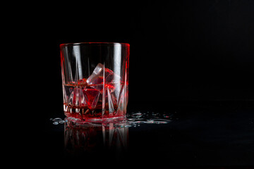 glass of whiskey with ice
