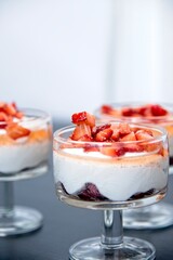 Strawberries in whipped cream in a crystal glass goblet. High quality photo