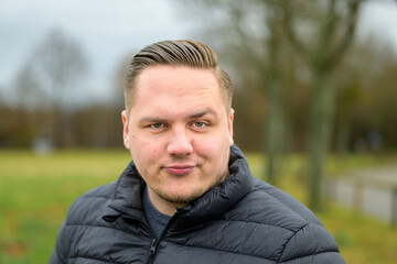 Dubious young man pullling a sceptical face