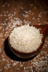 The rice is on the wooden table