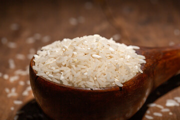 The rice is on the wooden table