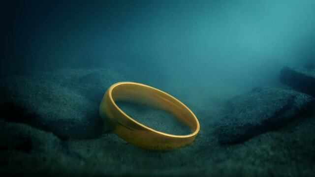 Magic Gold Ring Drops Onto Lake Floor