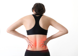 Back view of woman holding sore back neck and shoulder and waist(marking red)