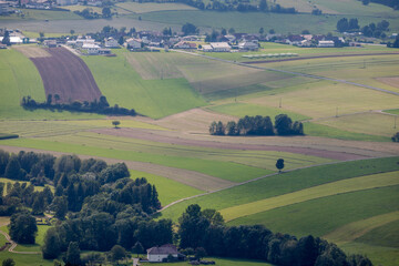 Obraz premium view from above on the rolling agricultural landscape