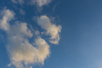 Patterns of clouds forming in blue sky creating an abstract background
