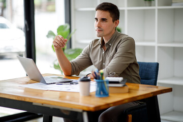 Businessman accountant or financial expert analyze business report graph and finance chart at corporate office. Concept of finance economy, banking business and stock market research.