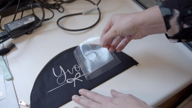 A female making a print on a cloth