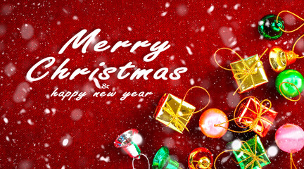 Fototapeta na wymiar Merry Christmas and happy new year concept, Christmas gift with colorful balls, stars, bells and snow on red background. 