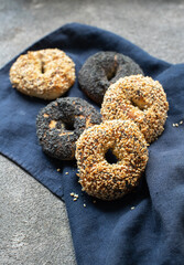 Homemade freshly baked bagels. with poppy seed and sesame. Close up.