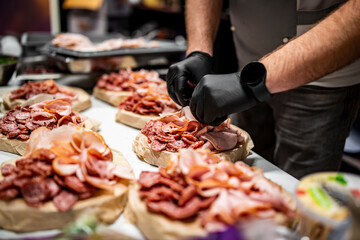 Chef hand is in process of Preparing catering food