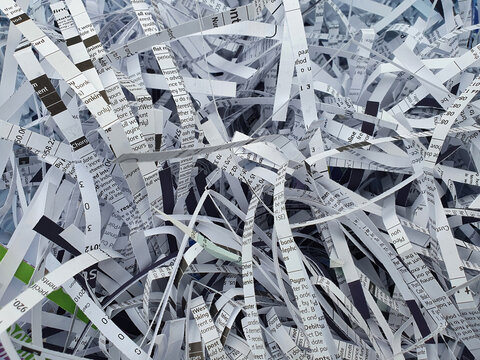 Shredded paper documents background which is garbage waste trash ready for recycling to prevent fraud and identity theft, stock photo image