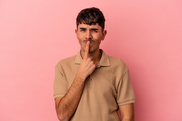 Fototapeta premium Young mixed race man isolated on pink background thinking and looking up, being reflective, contemplating, having a fantasy.