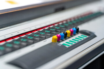 Offset printing press. Color correction unit. CMYK ink keys.