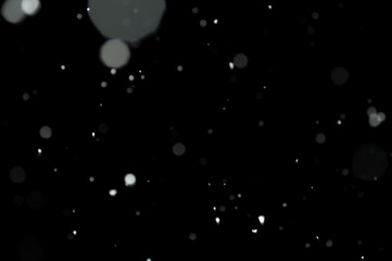 A texture of blurred snowflakes during the snowstorm in the dark