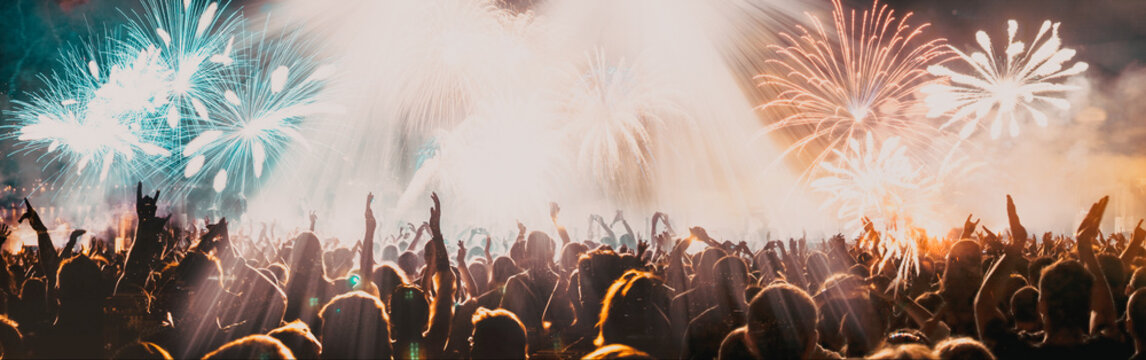 crowd and explosive fireworks New Year celebrations