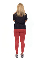 Fototapeta premium back view of woman with sportswear arms crossed on white background,