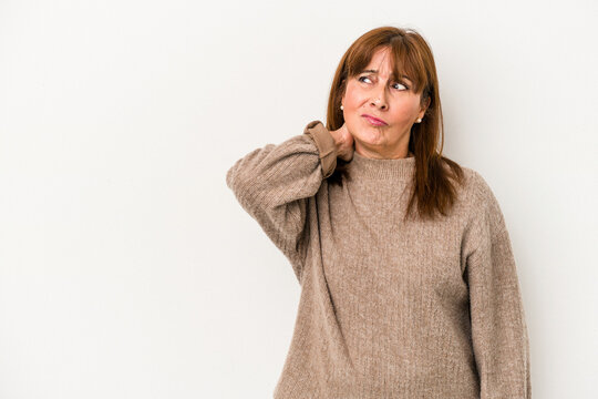 Middle age caucasian woman isolated on white background touching back of head, thinking and making a choice.