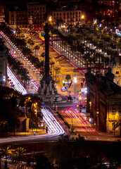 Mesmerizing view of illuminated city of Barcelona with historical buildings and statues in Spain