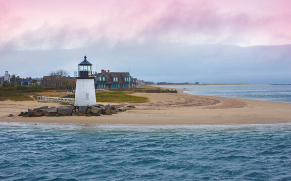 Seascape with Brant Point Lighthouse and dramatic pink cloudscape at twilight in Nantucket Massachusetts