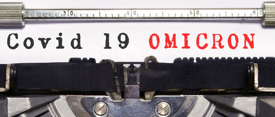 Covid-19 new omicron virus variant symbol. Concept words 'Covid 19 Omicron' typed on vintage...