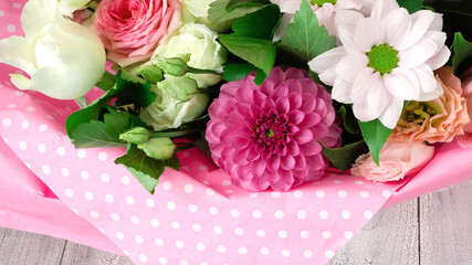 Festive surprise for mom's day with flowers. Banner with a bouquet of flowers in pink