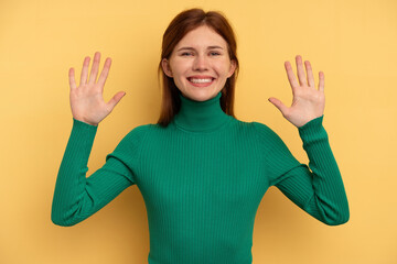 Fototapeta premium Young English woman isolated on yellow background showing number ten with hands.