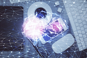 Double exposure of brain drawing over work table desktop. Top view. Global data analysis concept.