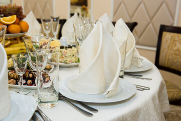 Cold snacks on the festive table. A table with food served with dishes for guests.