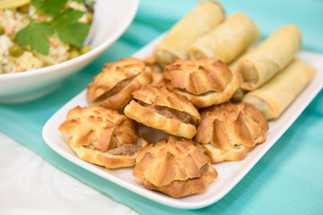 Bread on the festive table. A table with food served with dishes for guests.