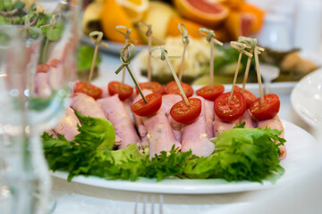 Cold snacks on the festive table. A table with food served with dishes for guests.