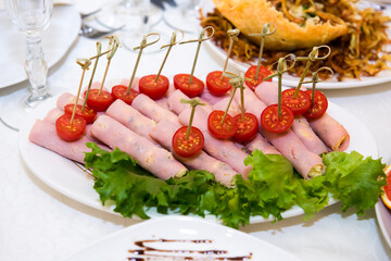 Cold snacks on the festive table. A table with food served with dishes for guests.