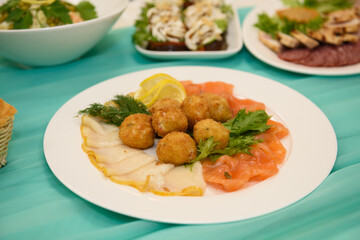 Cold snacks on the festive table. A table with food served with dishes for guests.