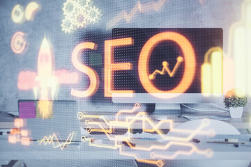 Double exposure of SEO drawing and office interior background. Concept of Search optimization...