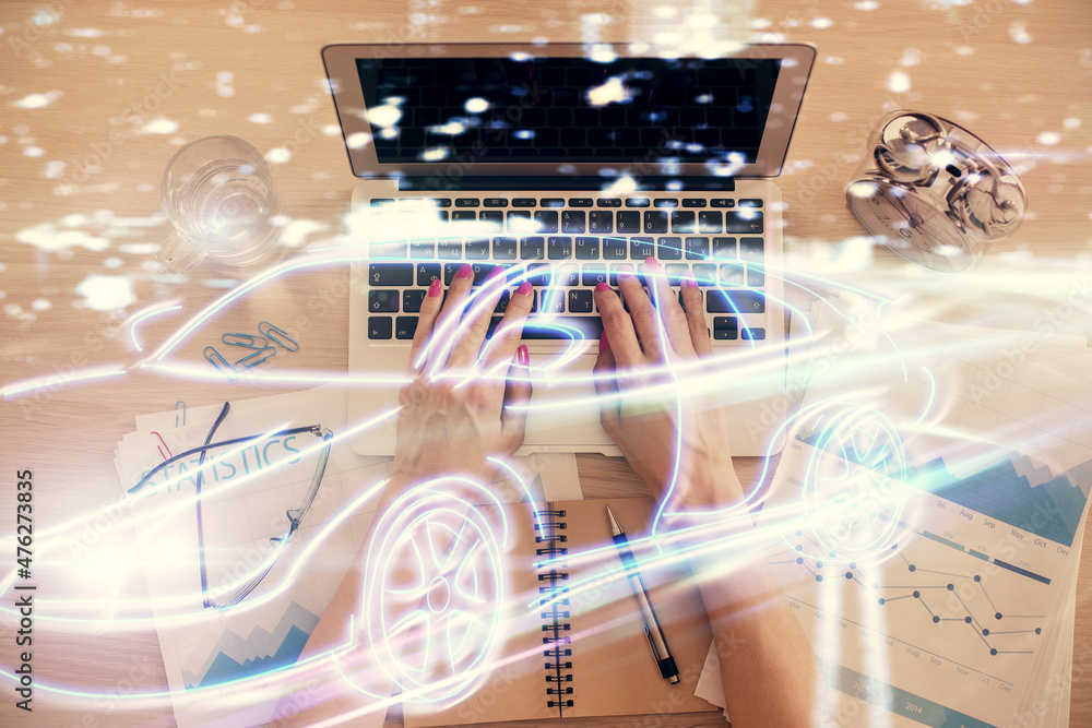 Poster double exposure of woman hands working on computer and car hologram drawing. top view. auto pilot co
