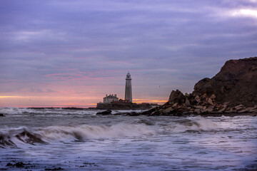 A spectacular sunrise at St Mary's Lighthouse in Whitley Bay, as the sky erupts in color