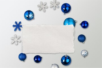 Greeting card for Christmas or New Year made of fir branches, decorations with paper card note.