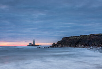 A spectacular sunrise at St Mary's Lighthouse in Whitley Bay, as the sky erupts in color