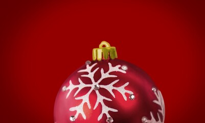 Beautiful Christmas ball against a colored background. Christmas decoration, festive atmosphere concept.