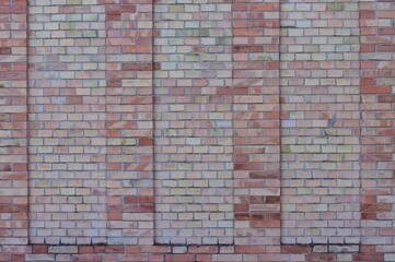 A background of a brick wall with buttresses (Pesaro, Italy, Europe)