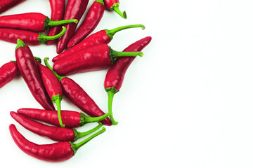 Red chili peppers isolated on white background. Pile of hot peppers